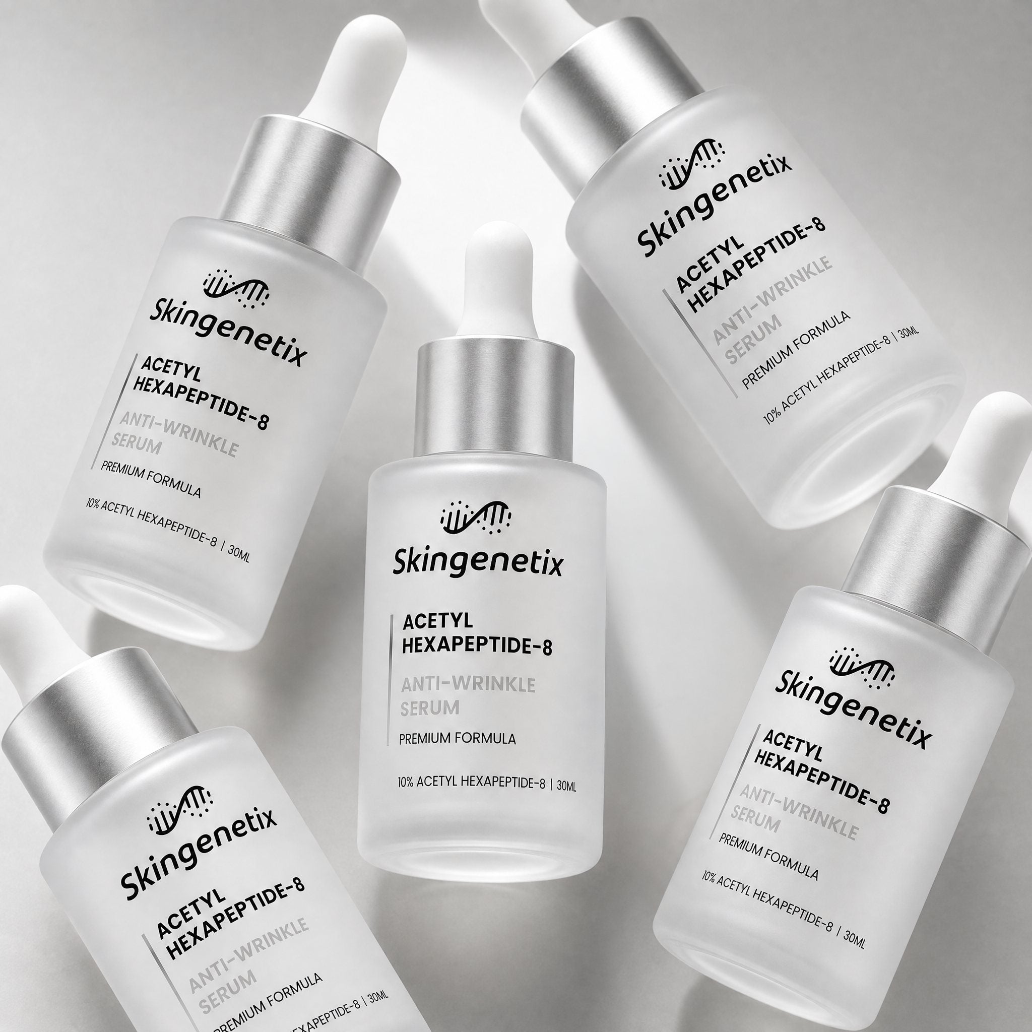 Skingenetix Acetyl Hexapeptide-8 Anti-Wrinkle Serum, 30ml - several bottles of the serum arranged in an angled group