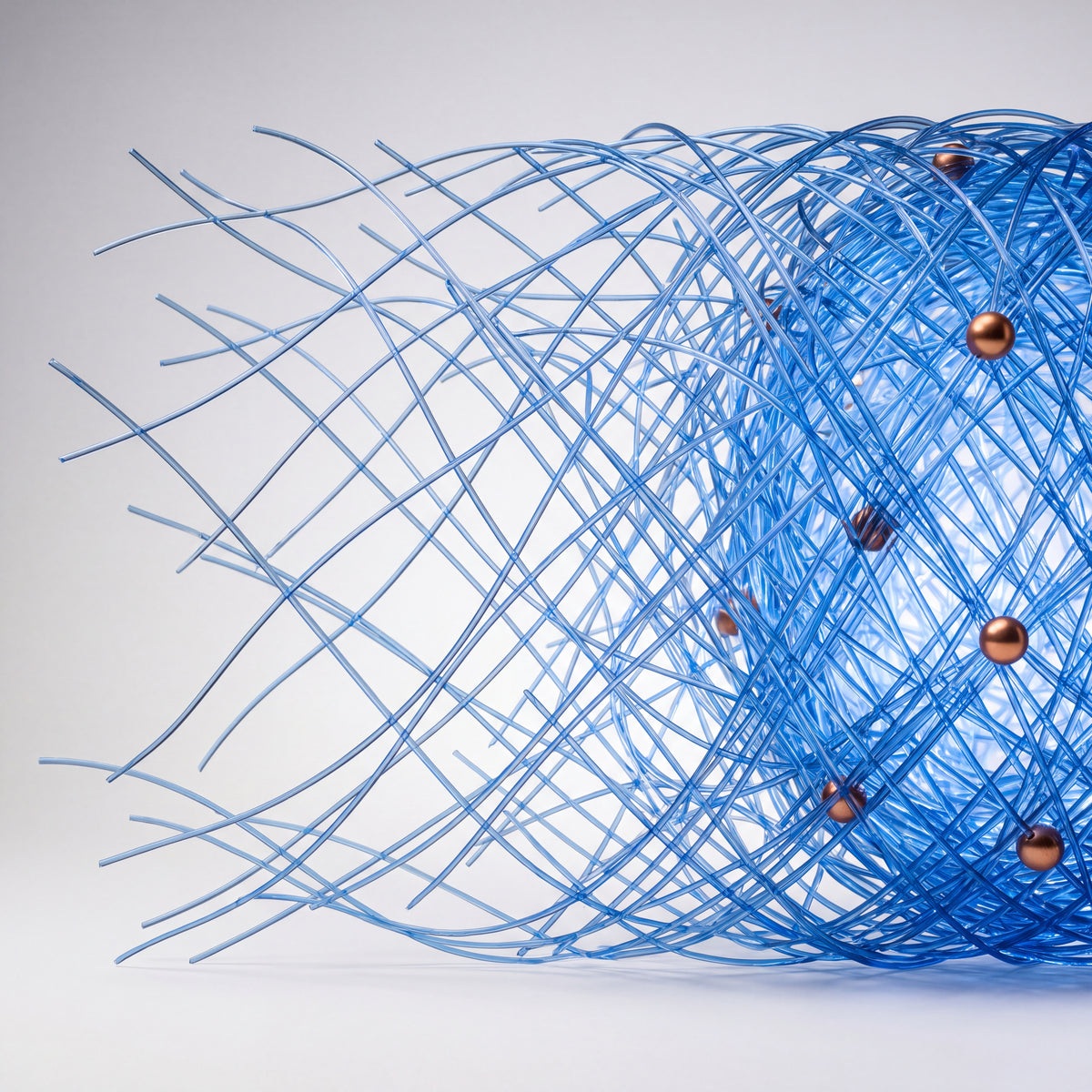 A blue collagen-fibre lattice thickening from loose strands into a dense copper-studded matrix - Skingenetix copper peptide skin renewal research