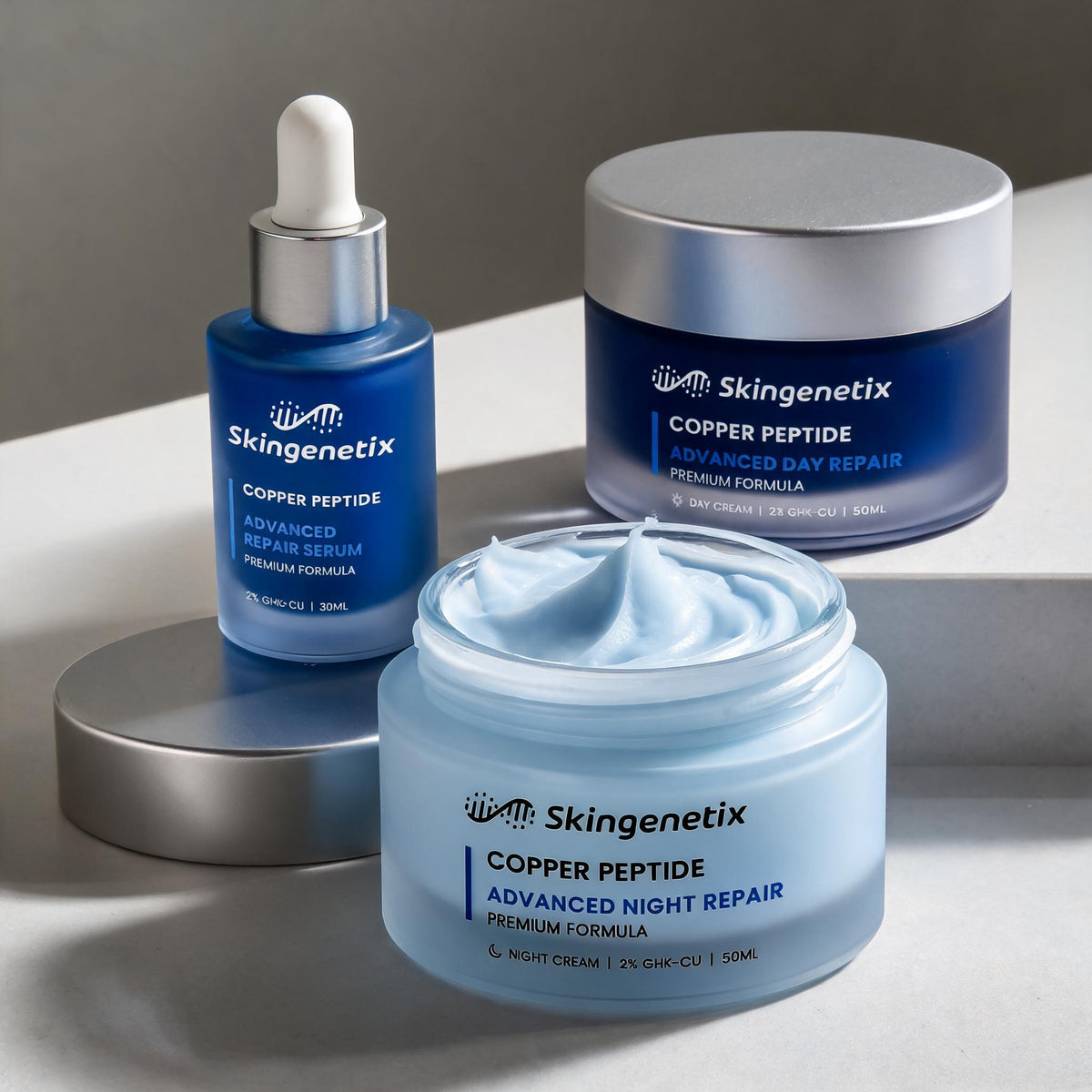 the night cream jar open beside the serum and day cream, with a cream swatch