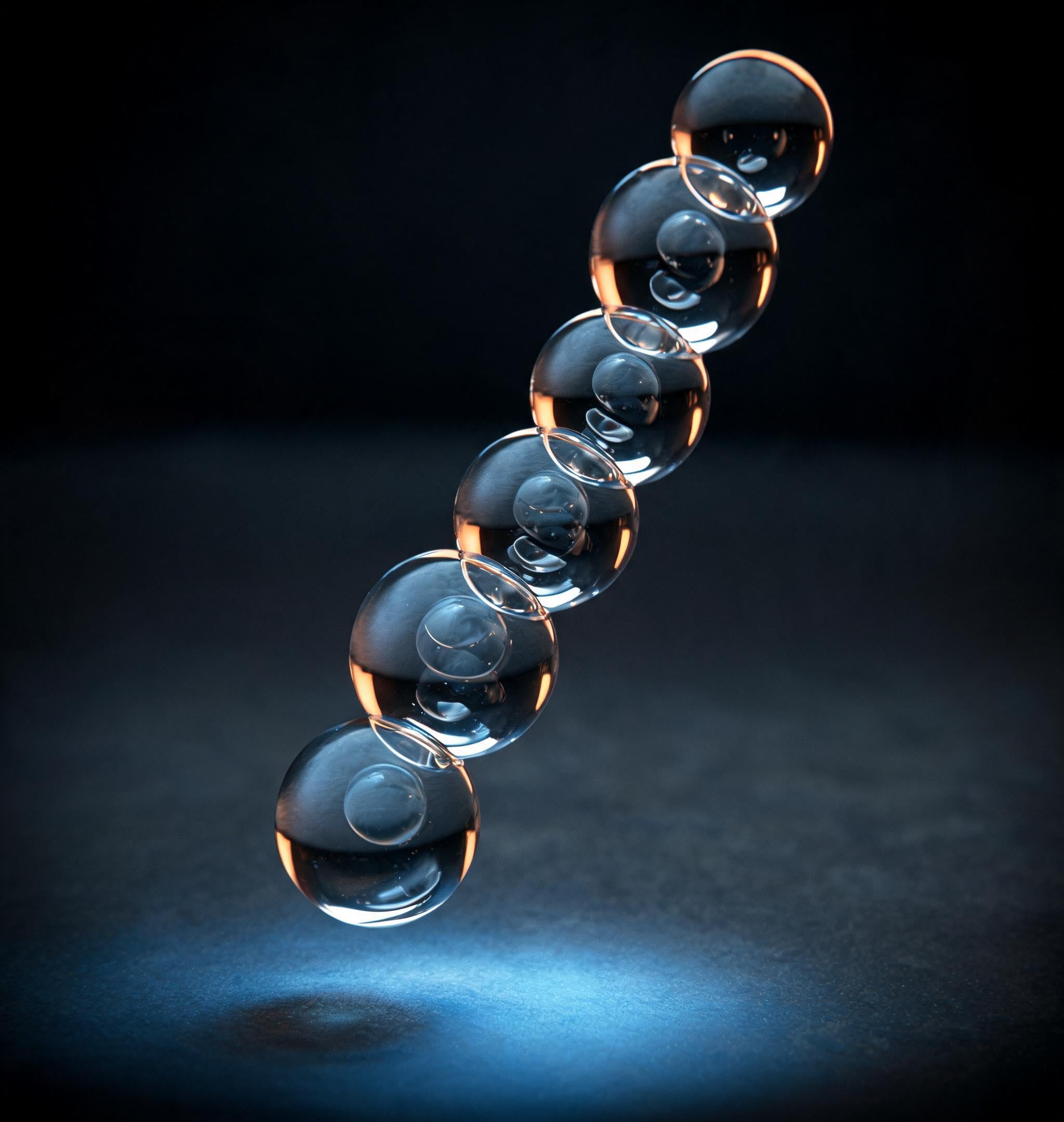 A chain of linked clear spheres lit against graphite, representing a peptide chain - the science behind Skingenetix formulations