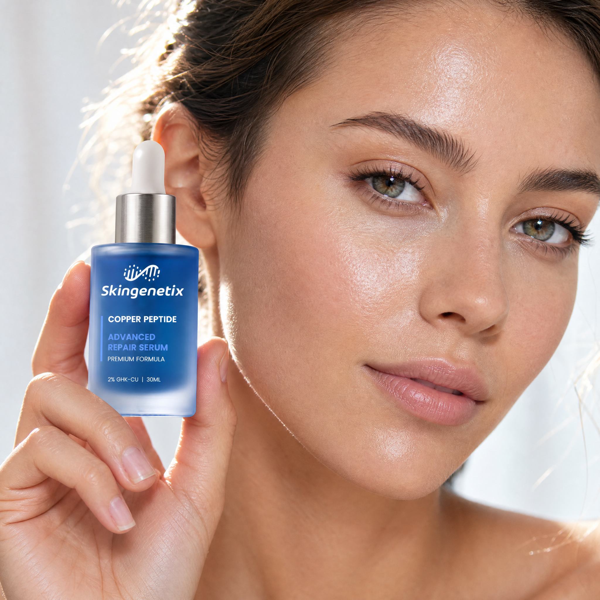 Skingenetix Copper Peptide (GHK-Cu) 2% Renewal Serum, 30ml - a model holding the bottle beside their face