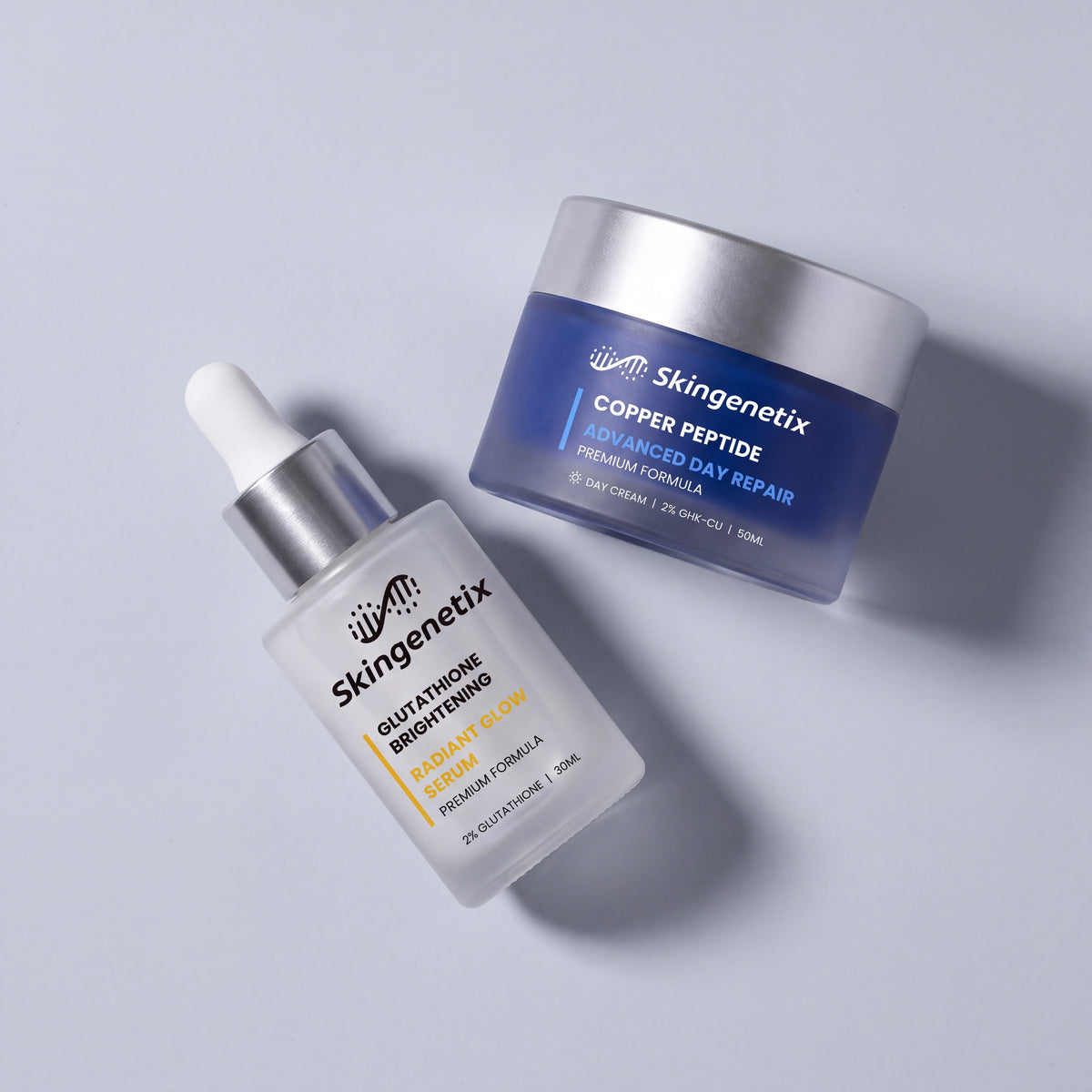 Skingenetix Brightening & Glow Duo Set - the serum and day gel-cream lying tilted on a pale surface