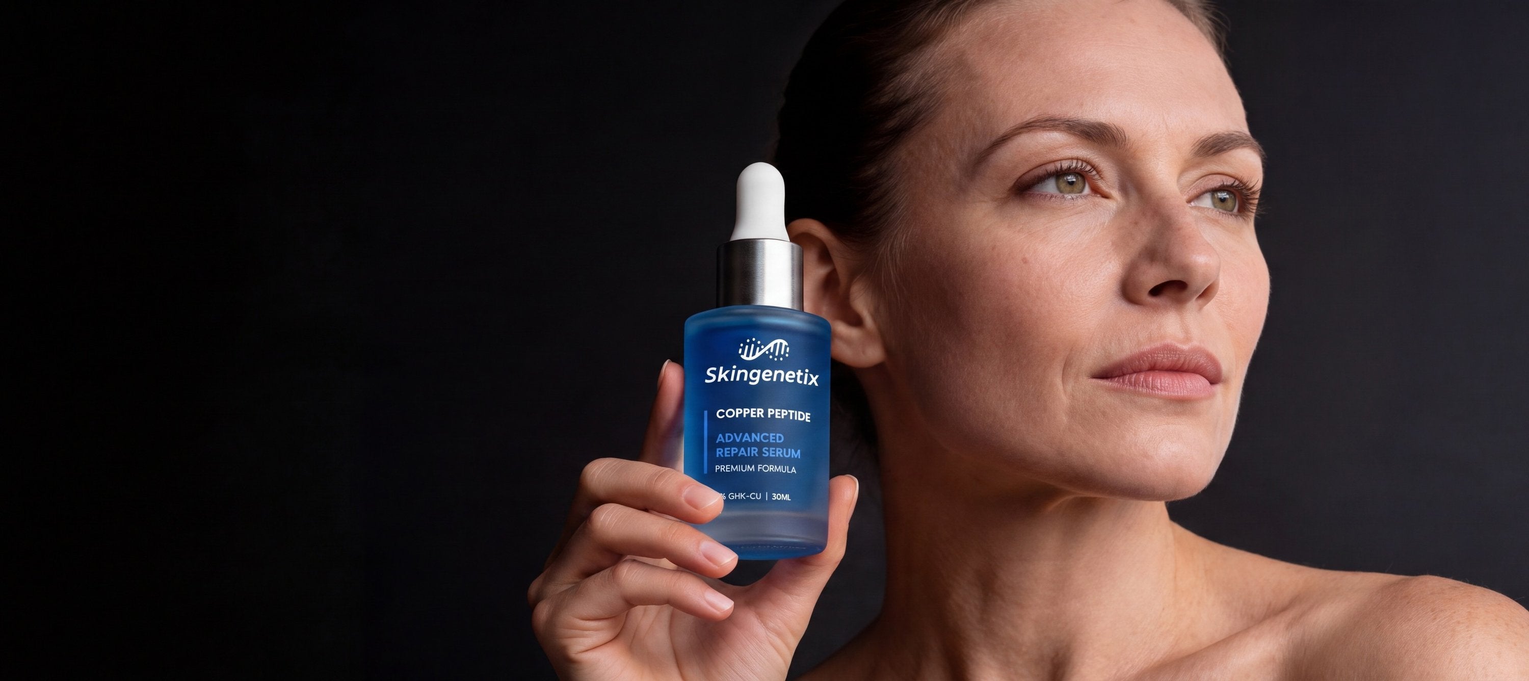 Skingenetix Copper Peptide (GHK-Cu) 2% Renewal Serum held beside a model's face