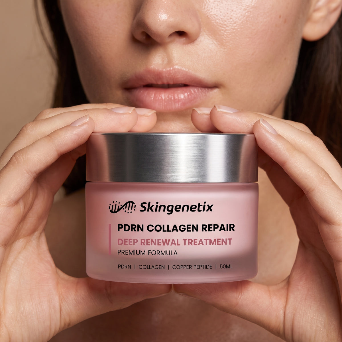 A model holding the Skingenetix PDRN 1% Collagen Night Cream jar, 50ml, in both hands beside her chin, in close-up