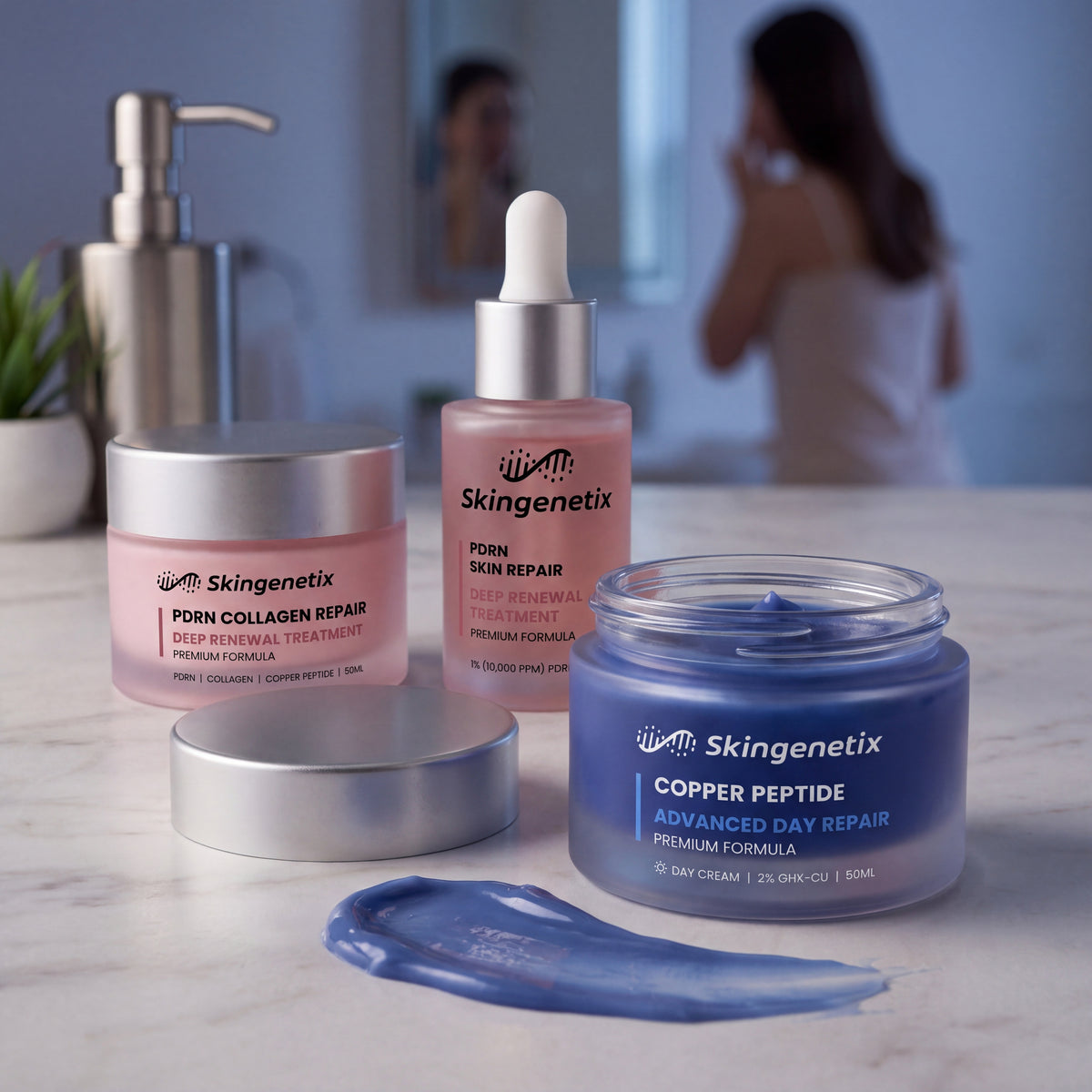Skingenetix Complete Skin Repair & Renewal Day & Night Routine - the copper peptide day gel-cream open beside a swatch of the gel, with the PDRN serum behind