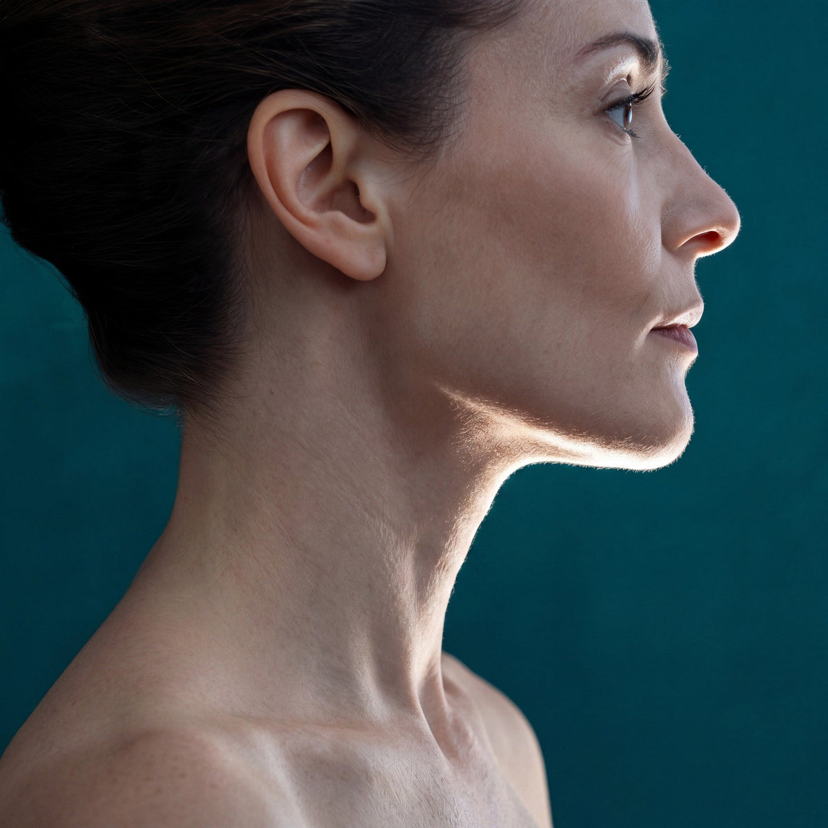 Defined jawline and neck in profile - Skingenetix peptide treatment for skin firming and density